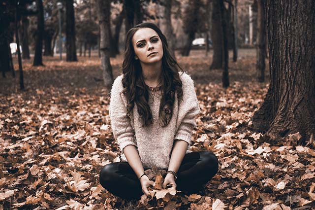 A thoughtful teenager outdoors